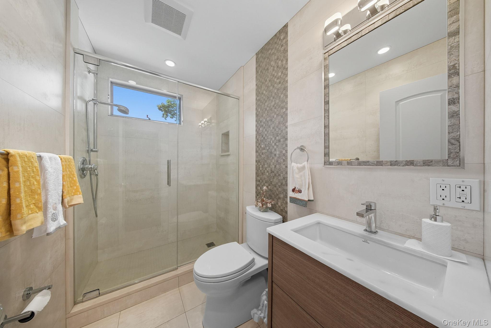 58 James Road Monroe, NY 10950 - Photo 14 of 24 a bathroom with a sink a toilet and shower