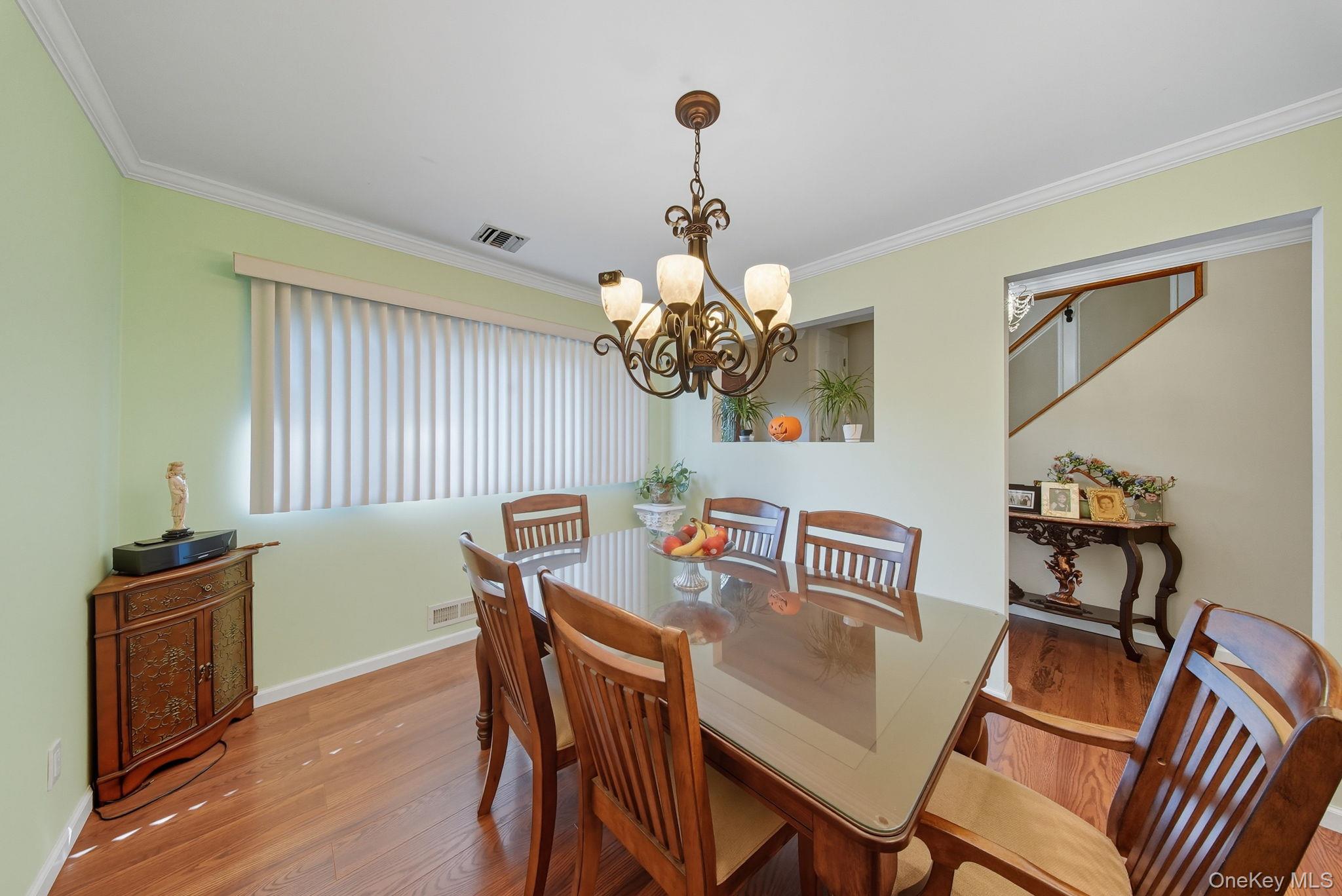 58 James Road Monroe, NY 10950 - Photo 6 of 24 a view of a dining room with furniture and wooden floor