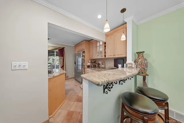a view of living room with granite countertop furniture and a fireplace