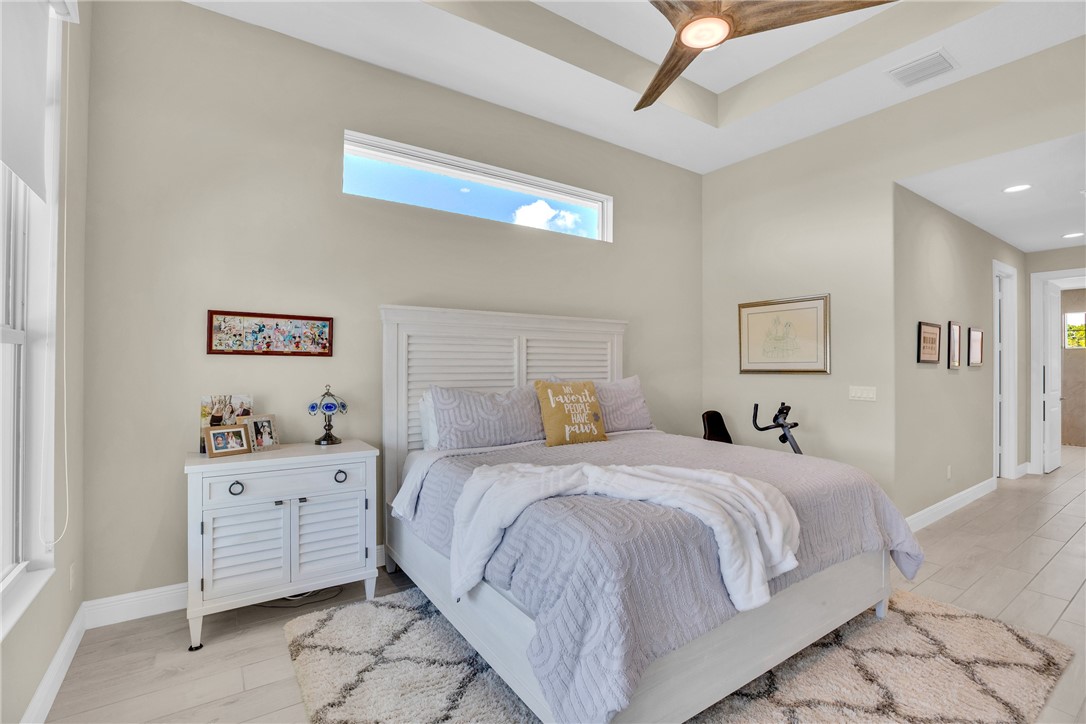 105 Night Hawk Way Sebastian, FL 32958 - Photo 15 of 36 a bedroom with a bed and a window