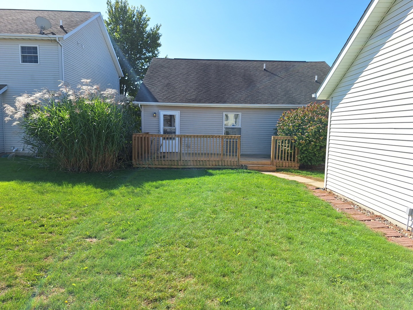 1104 Whitaker Street Normal, IL 61761 - Photo 16 of 19 a view of a house with a yard and a garage