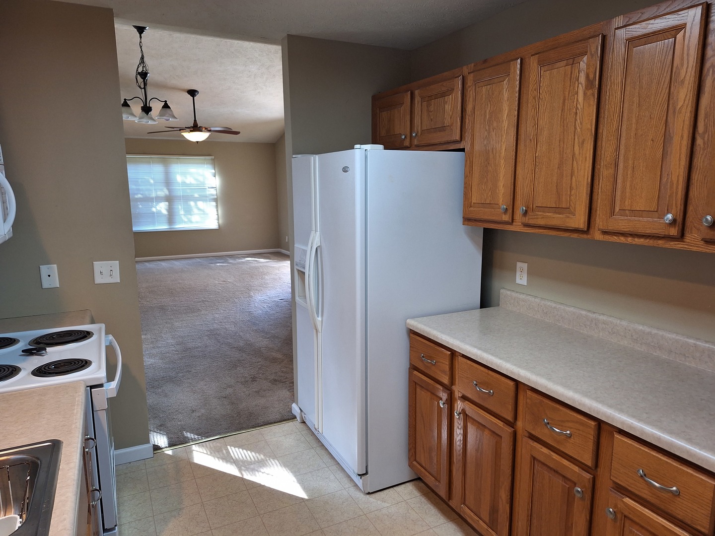 1104 Whitaker Street Normal, IL 61761 - Photo 4 of 19 a kitchen with stainless steel appliances a refrigerator and a stove top oven