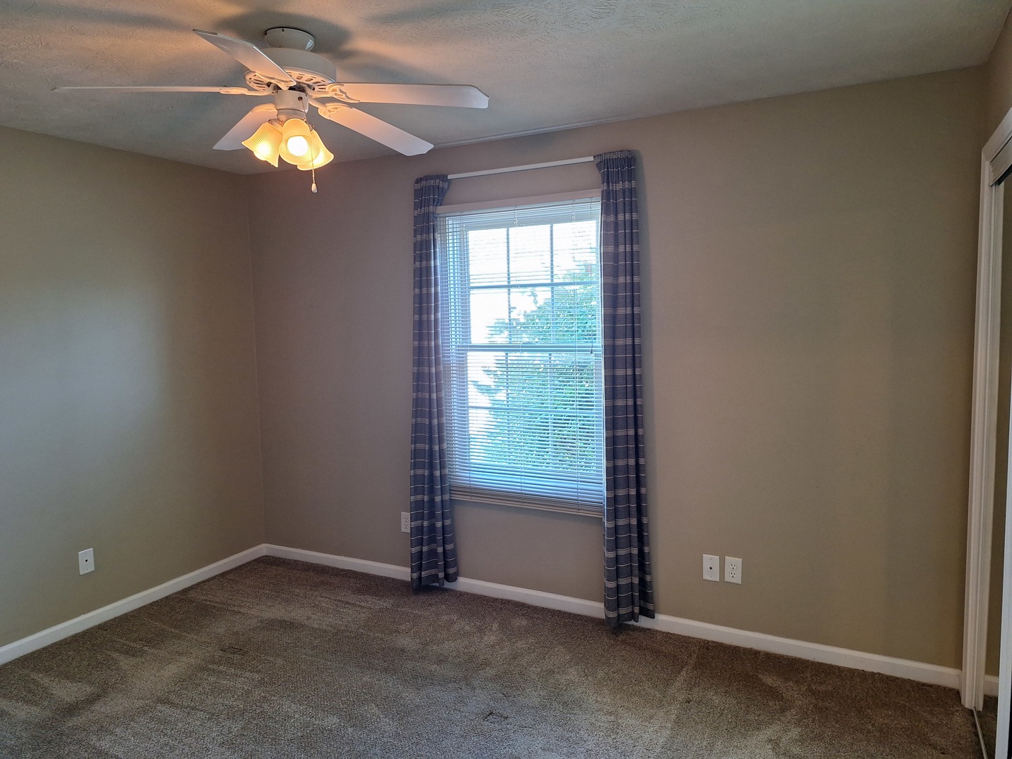 1104 Whitaker Street Normal, IL 61761 - Photo 9 of 19 an empty room with windows chandelier fan
