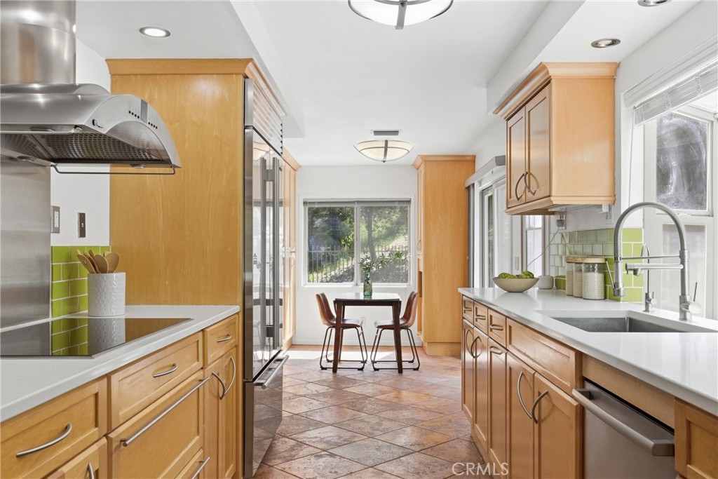41 Hidden Valley Road Monrovia, CA 91016 - Photo 13 of 51 a kitchen with counter top space and dining table