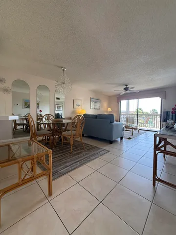 a living room with lots of furniture and a table