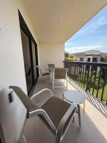 a balcony with chairs