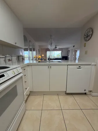 a kitchen with cabinets and appliances