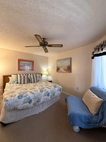 a bedroom with bed and window