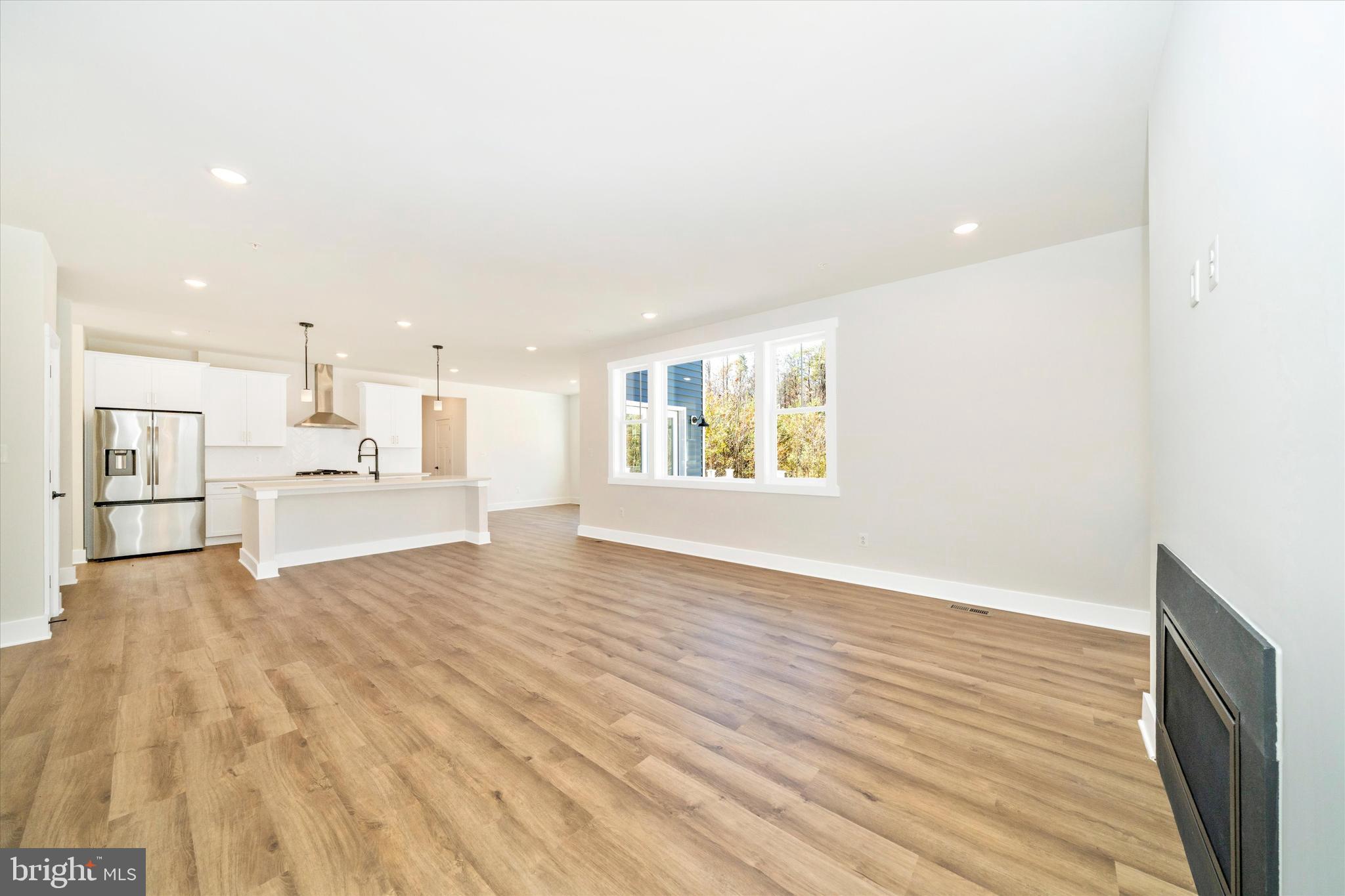 1156 Mt Zion Marlboro Road Lothian, MD 20711 - Photo 14 of 73 a view of an empty room with wooden floor and a window