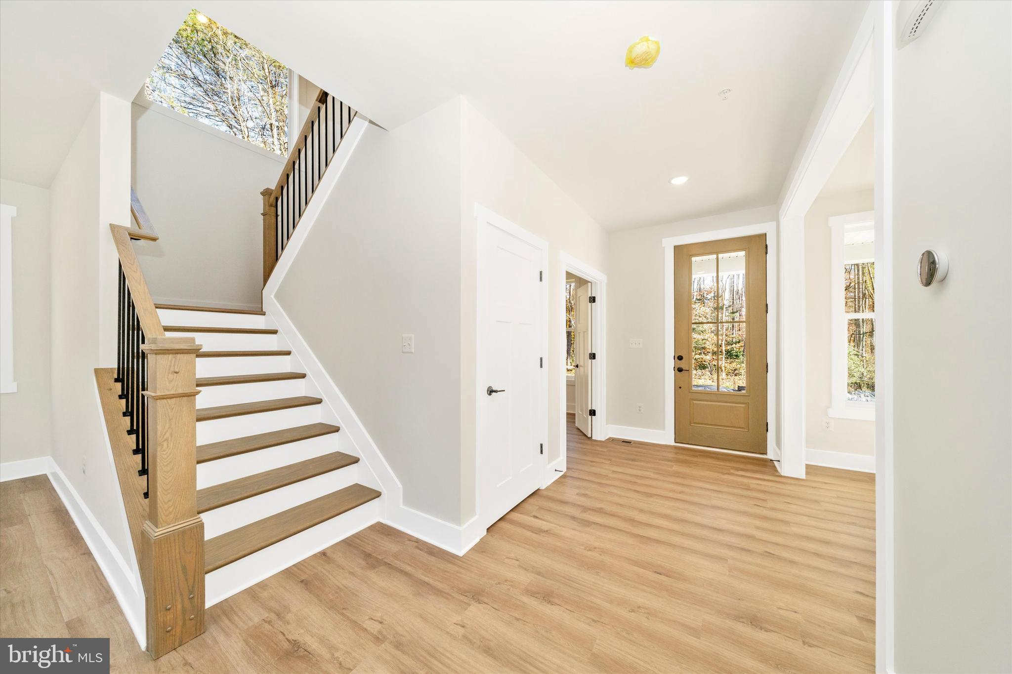 1156 Mt Zion Marlboro Road Lothian, MD 20711 - Photo 2 of 73 a view of a livingroom with wooden floor and stairs