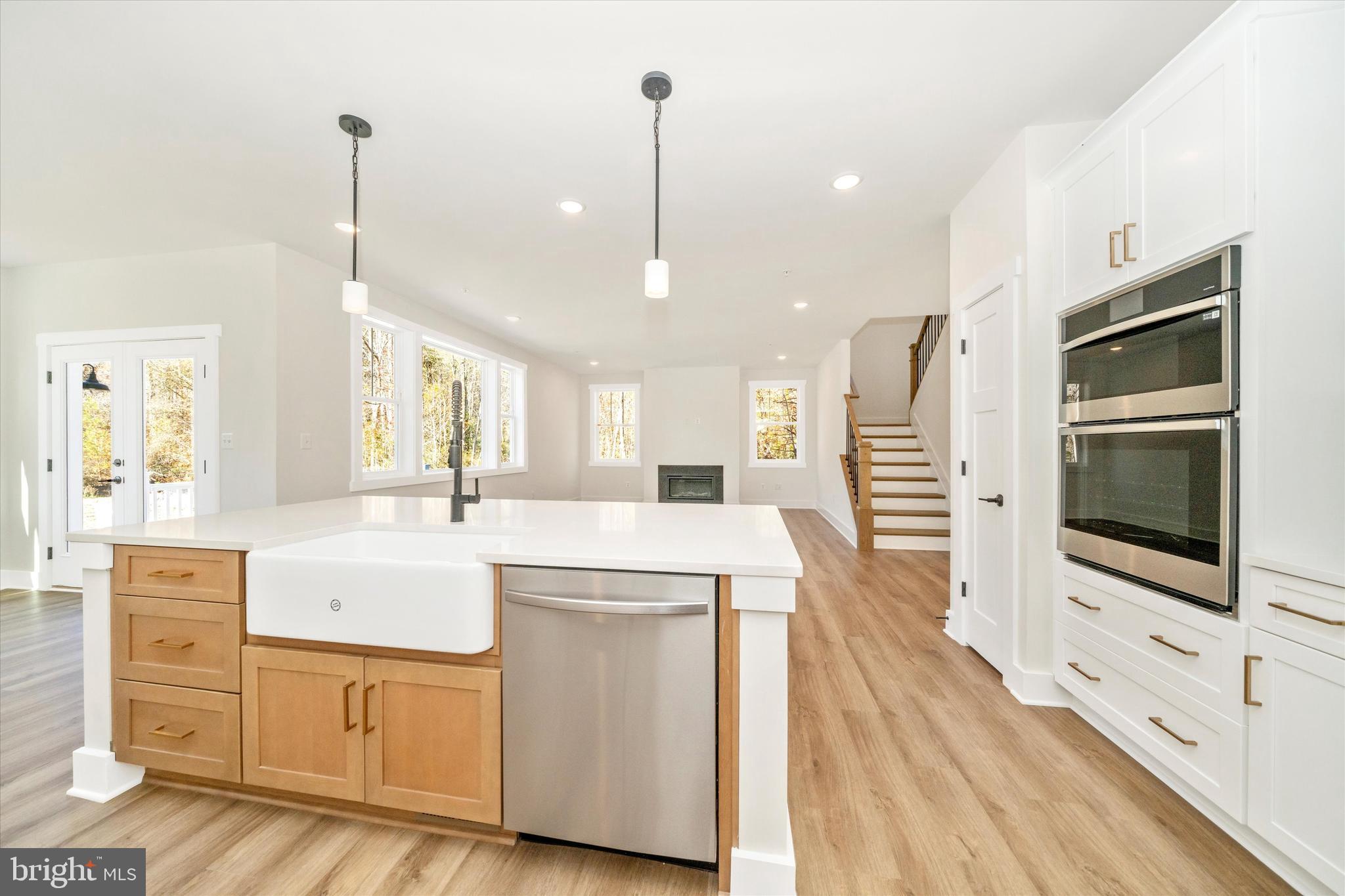1156 Mt Zion Marlboro Road Lothian, MD 20711 - Photo 23 of 73 a open kitchen with white cabinets sink and stainless steel appliances