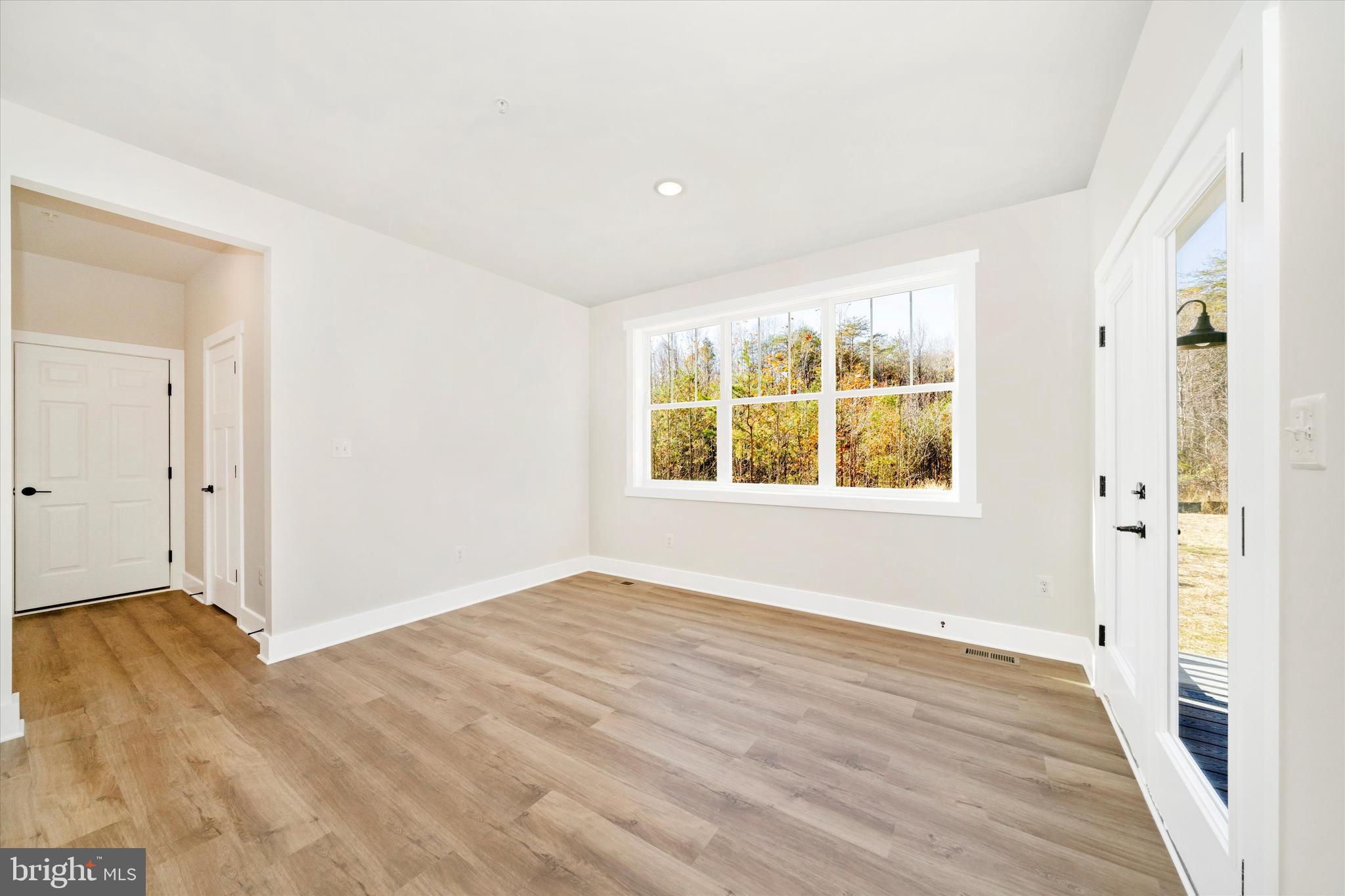 1156 Mt Zion Marlboro Road Lothian, MD 20711 - Photo 24 of 73 wooden floor in an empty room with a window