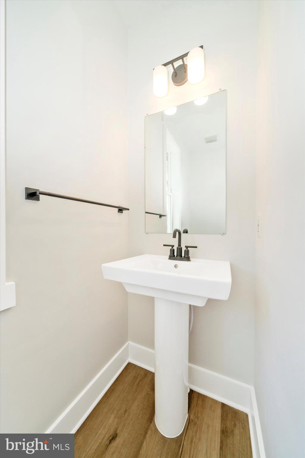 1156 Mt Zion Marlboro Road Lothian, MD 20711 - Photo 27 of 73 a bathroom with a sink a mirror and a toilet