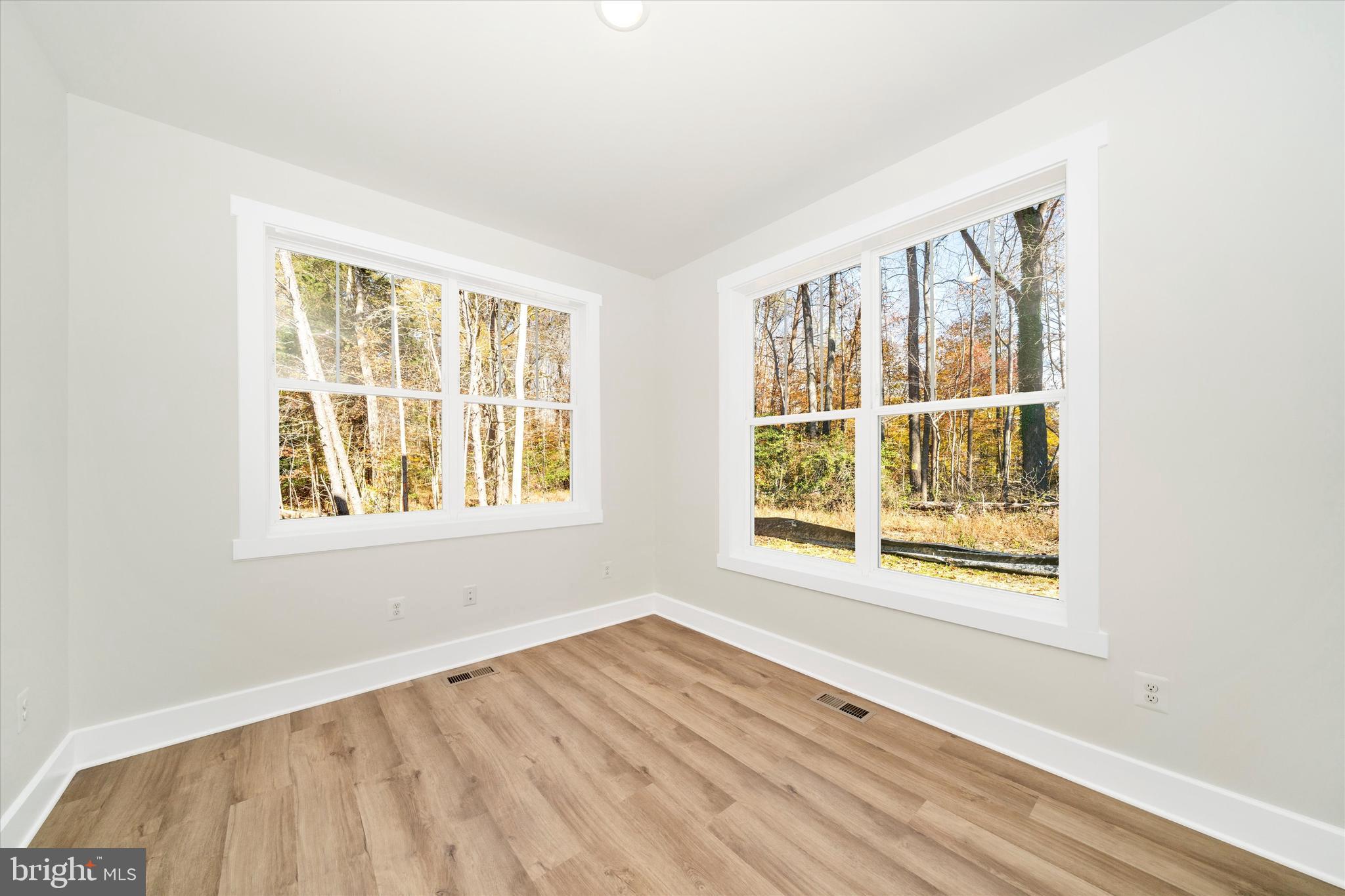 1156 Mt Zion Marlboro Road Lothian, MD 20711 - Photo 3 of 73 a view of an empty room with wooden floor and a window