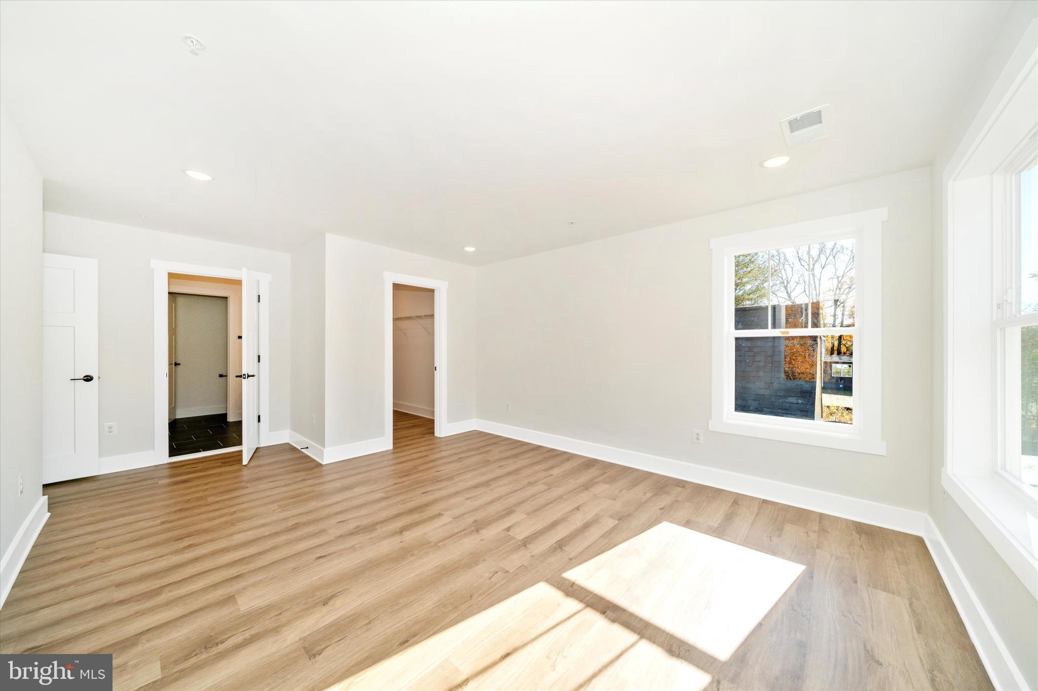 1156 Mt Zion Marlboro Road Lothian, MD 20711 - Photo 31 of 73 wooden floor in an empty room with a window