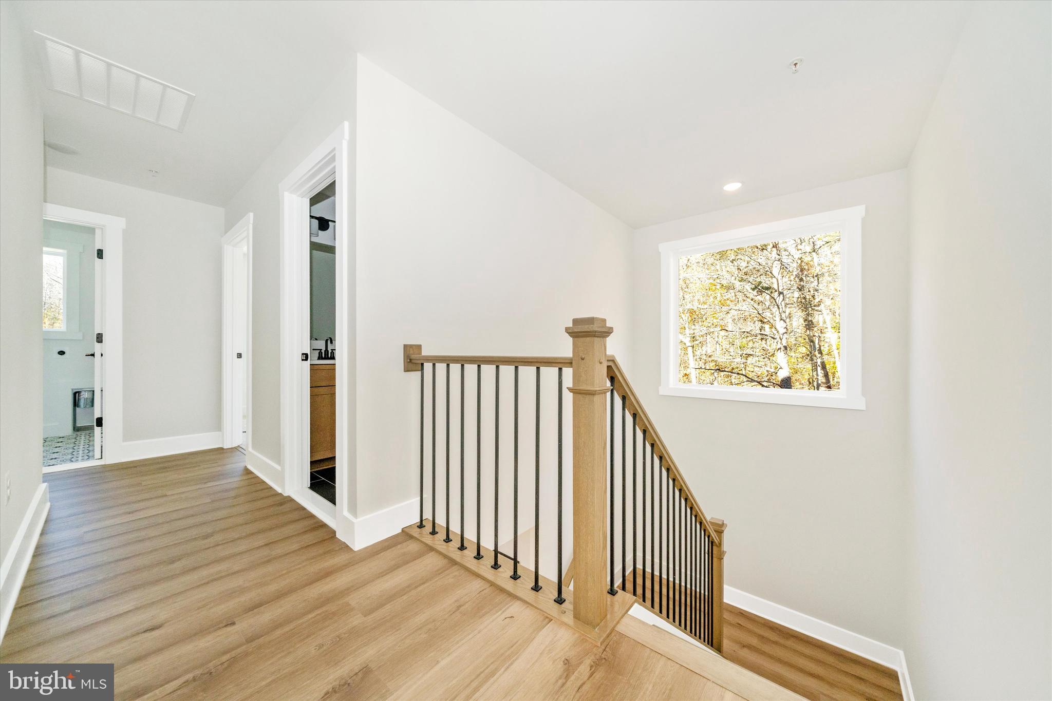 1156 Mt Zion Marlboro Road Lothian, MD 20711 - Photo 42 of 73 a view of a hallway with wooden floor and staircase