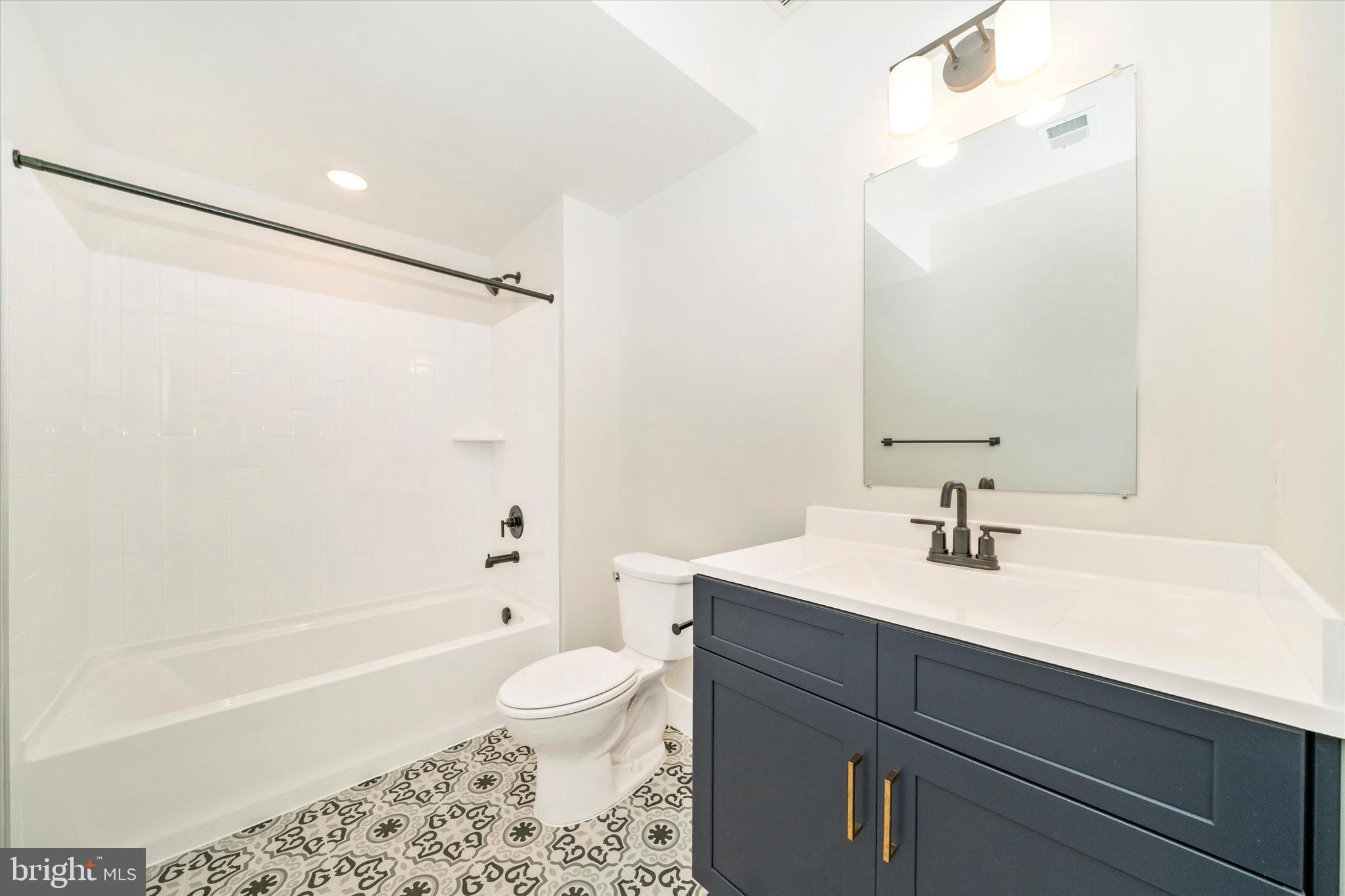 1156 Mt Zion Marlboro Road Lothian, MD 20711 - Photo 49 of 73 a bathroom with a sink a toilet and shower