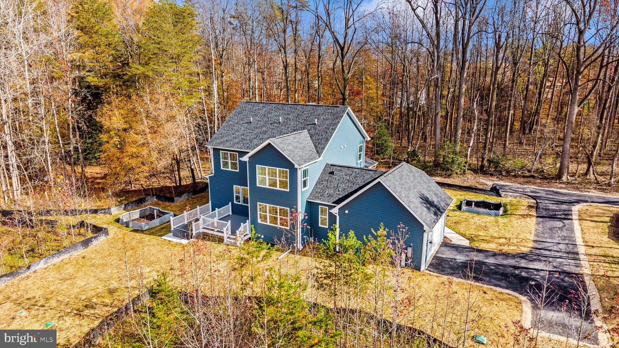 1156 Mt Zion Marlboro Road Lothian, MD 20711 - Photo 67 of 73 a view of a house with a small yard and wooden fence