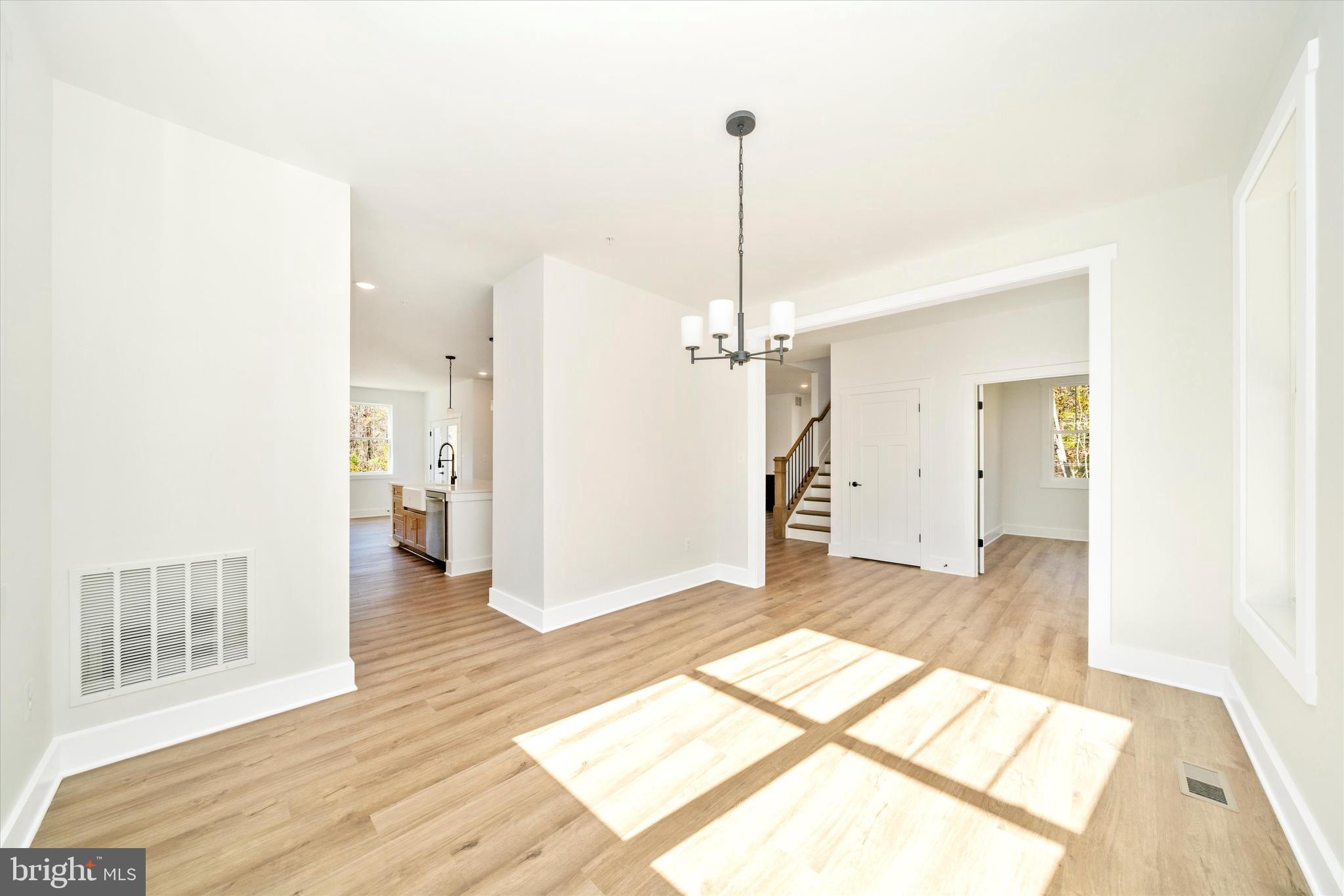 1156 Mt Zion Marlboro Road Lothian, MD 20711 - Photo 9 of 73 a view of a room with a furniture and floor to ceiling window