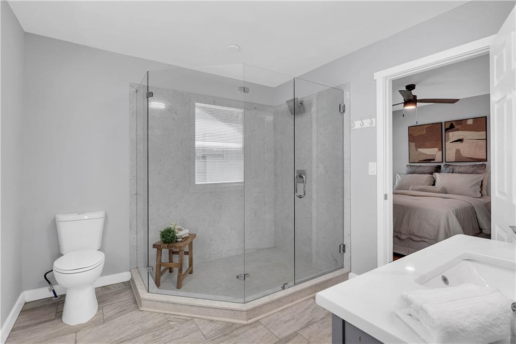 3910 Clairmont Road Atlanta, GA 30341 - Photo 13 of 16 a bathroom with a sink a toilet and shower