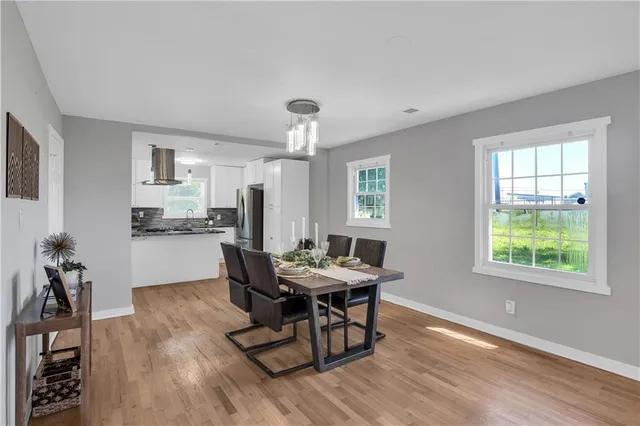 a view of a dining room with furniture and window