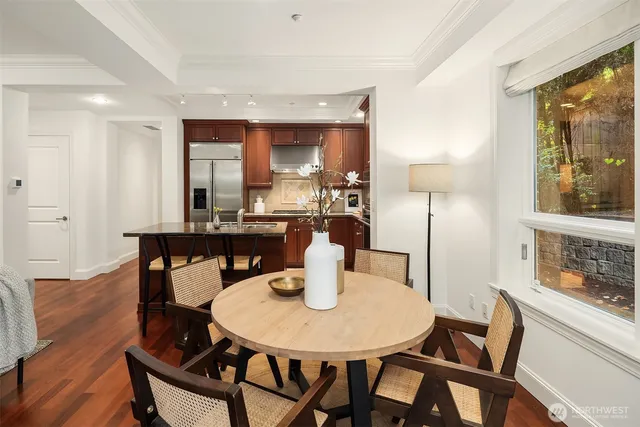 a view of a dining room with furniture and wooden floor