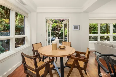 a view of a dining room with furniture window and outside view