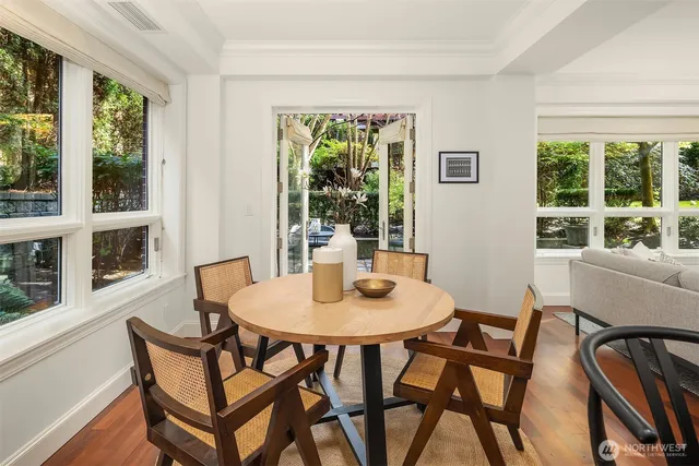 a view of a dining room with furniture window and outside view
