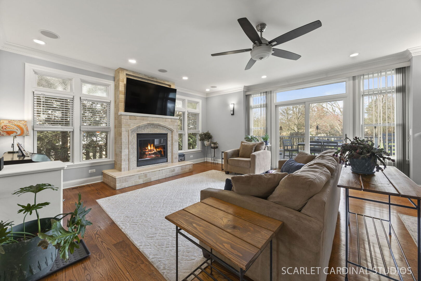 550 Edson Avenue Lombard, IL 60148 - Photo 13 of 32 a living room with furniture a fireplace and a flat screen tv