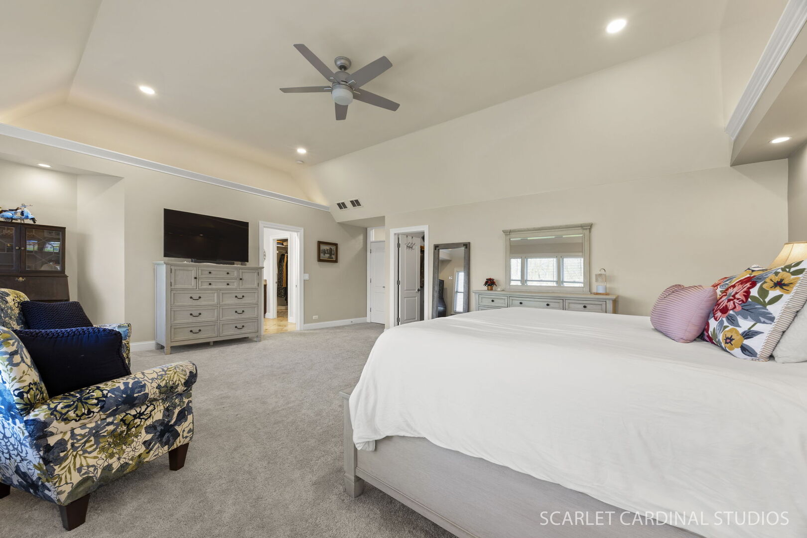 550 Edson Avenue Lombard, IL 60148 - Photo 18 of 32 a spacious bedroom with a bed a couch and a chandelier