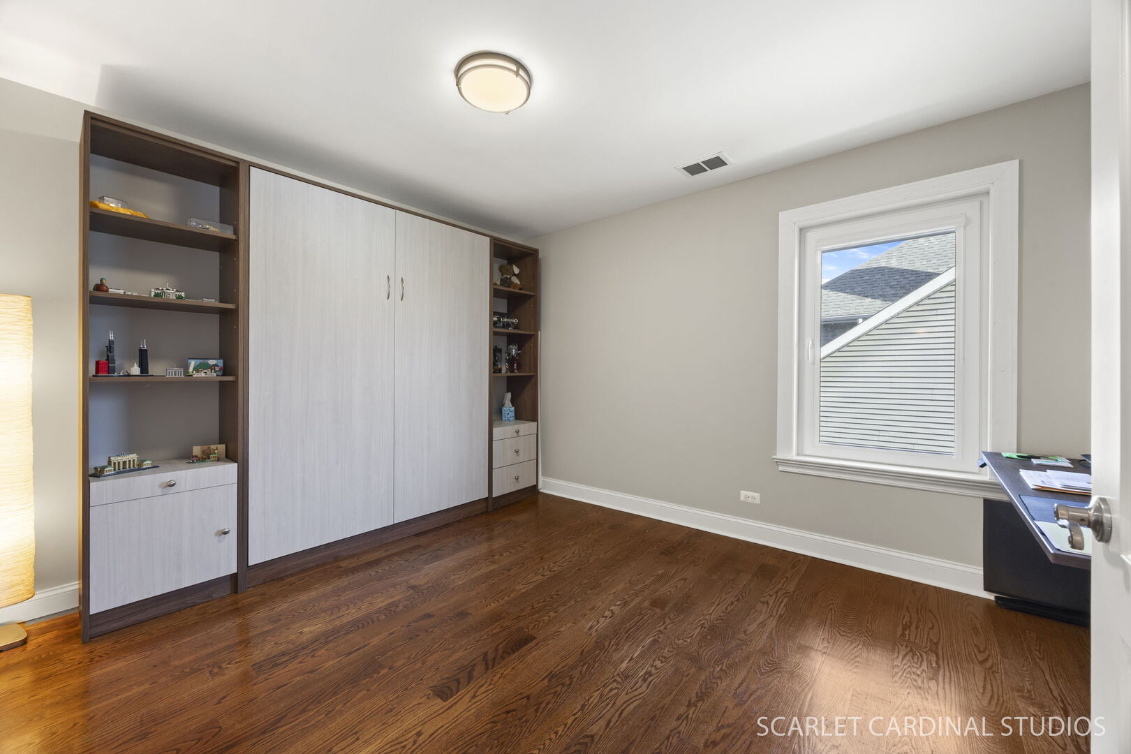 550 Edson Avenue Lombard, IL 60148 - Photo 28 of 32 an empty room with cabinet and wooden floor