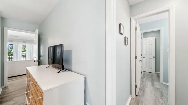 a bedroom with a bed and a flat tv screen