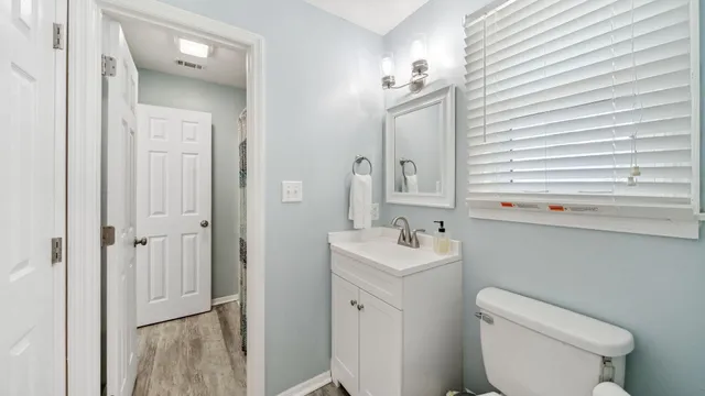 a view of a house with a tree in front