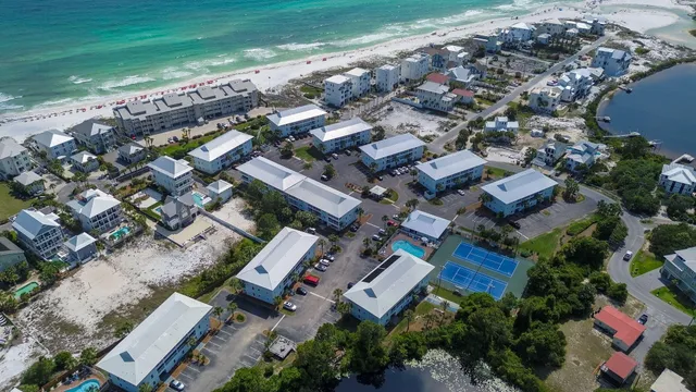 an aerial view of a house with a garden and lots of trees