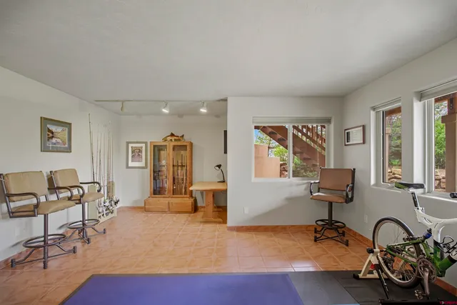 a view of a livingroom with workspace and a couch
