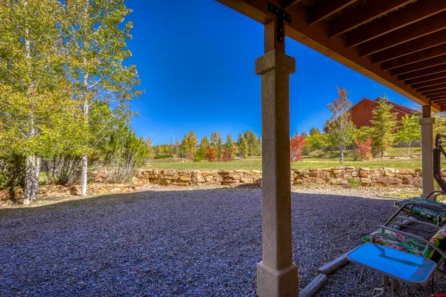 a view of a yard with an outdoor seating