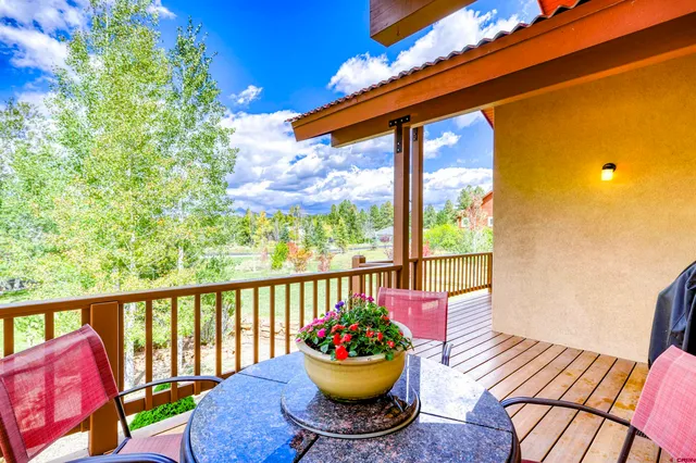 a front view of a house with outdoor seating