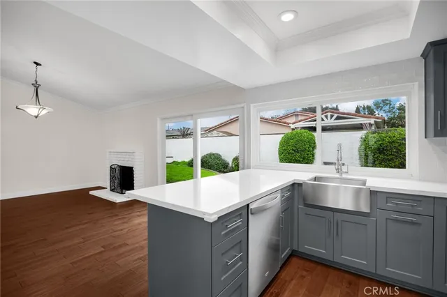 a kitchen with a sink and window