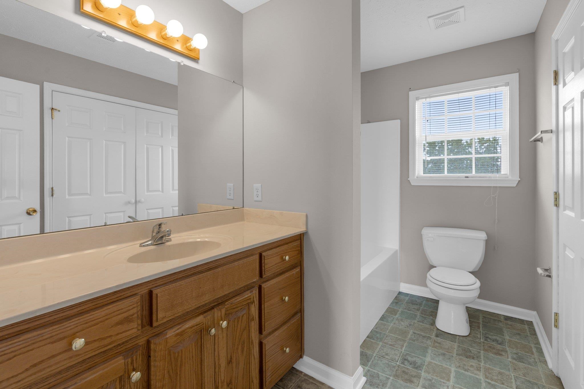 276 Mcbroom Road Henning, TN 38041 - Photo 18 of 36 Full bathroom with vanity, toilet, and shower / tub combination