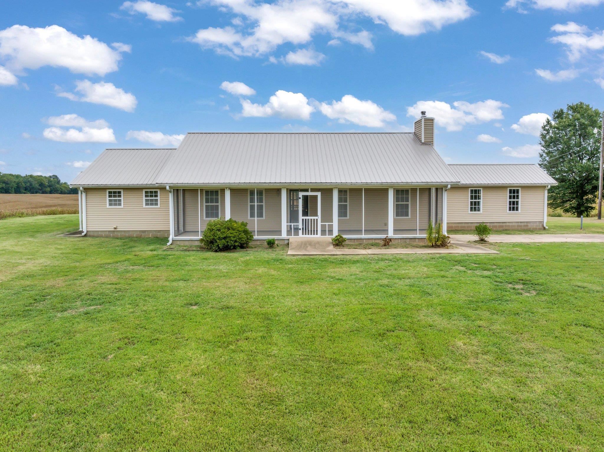 276 Mcbroom Road Henning, TN 38041 - Photo 2 of 36 Ranch-style house featuring a front yard and covered porch