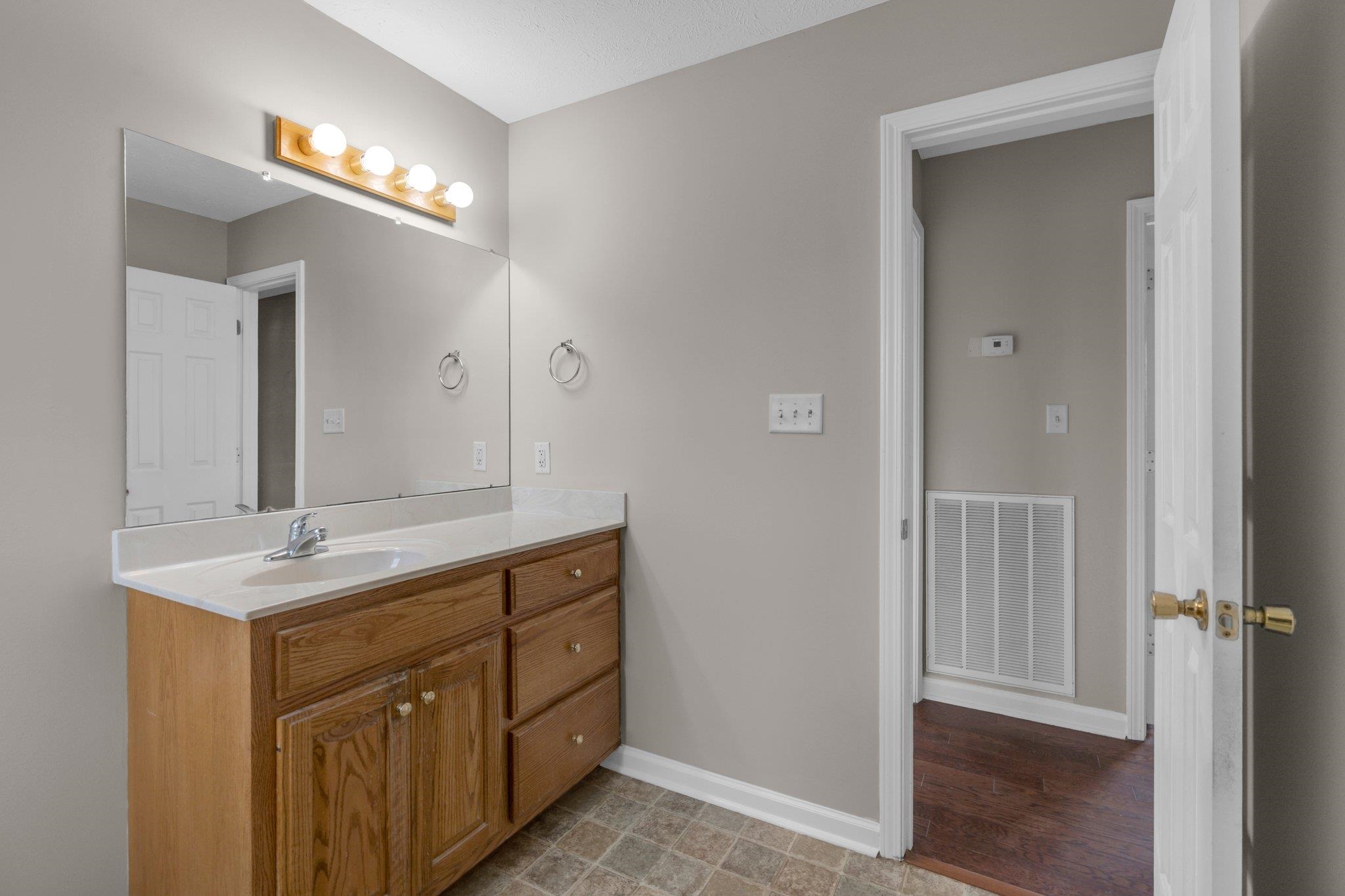 276 Mcbroom Road Henning, TN 38041 - Photo 23 of 36 Bathroom featuring vanity and hardwood / wood-style floors