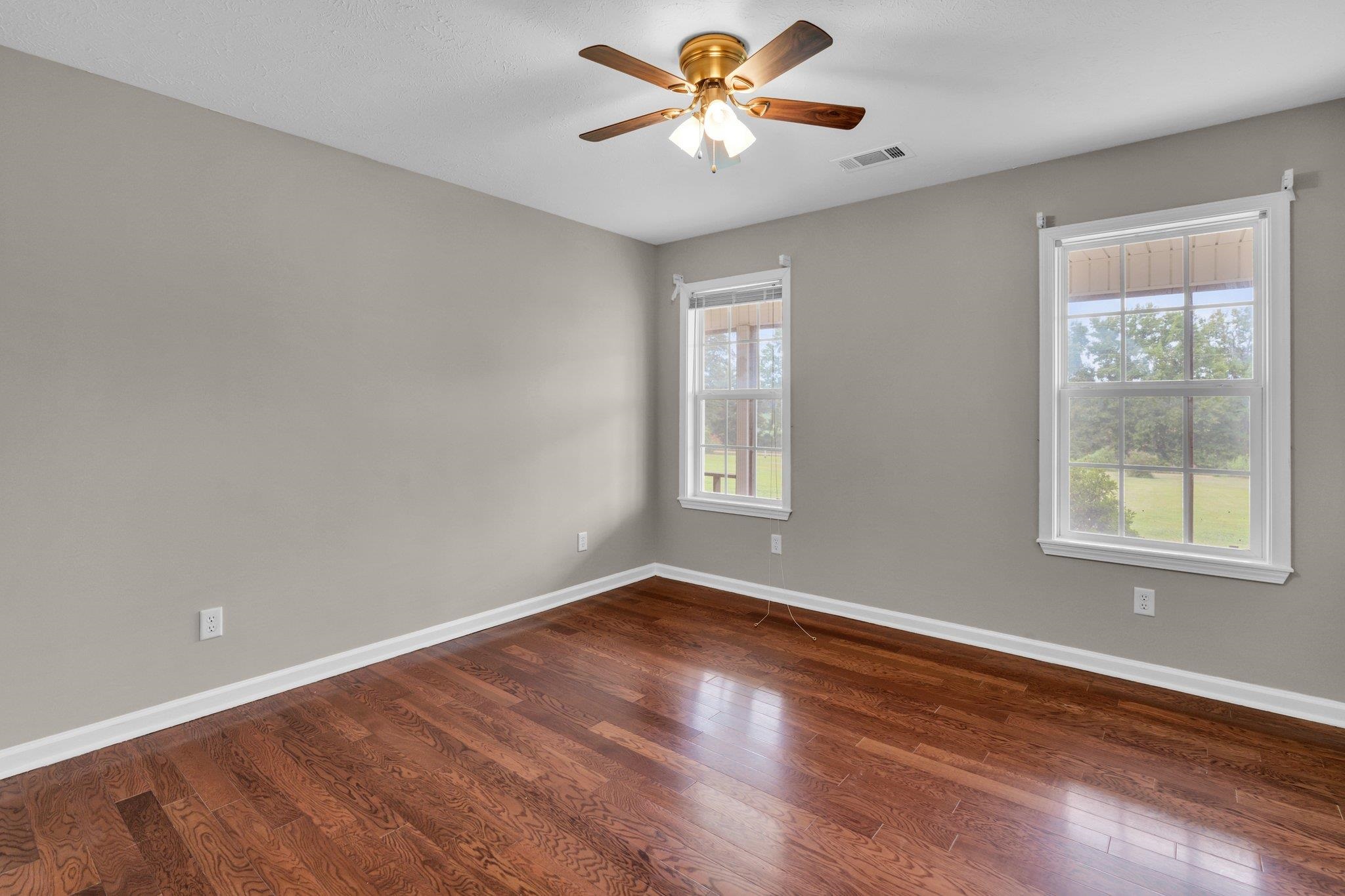 276 Mcbroom Road Henning, TN 38041 - Photo 24 of 36 Spare room featuring ceiling fan and hardwood / wood-style floors