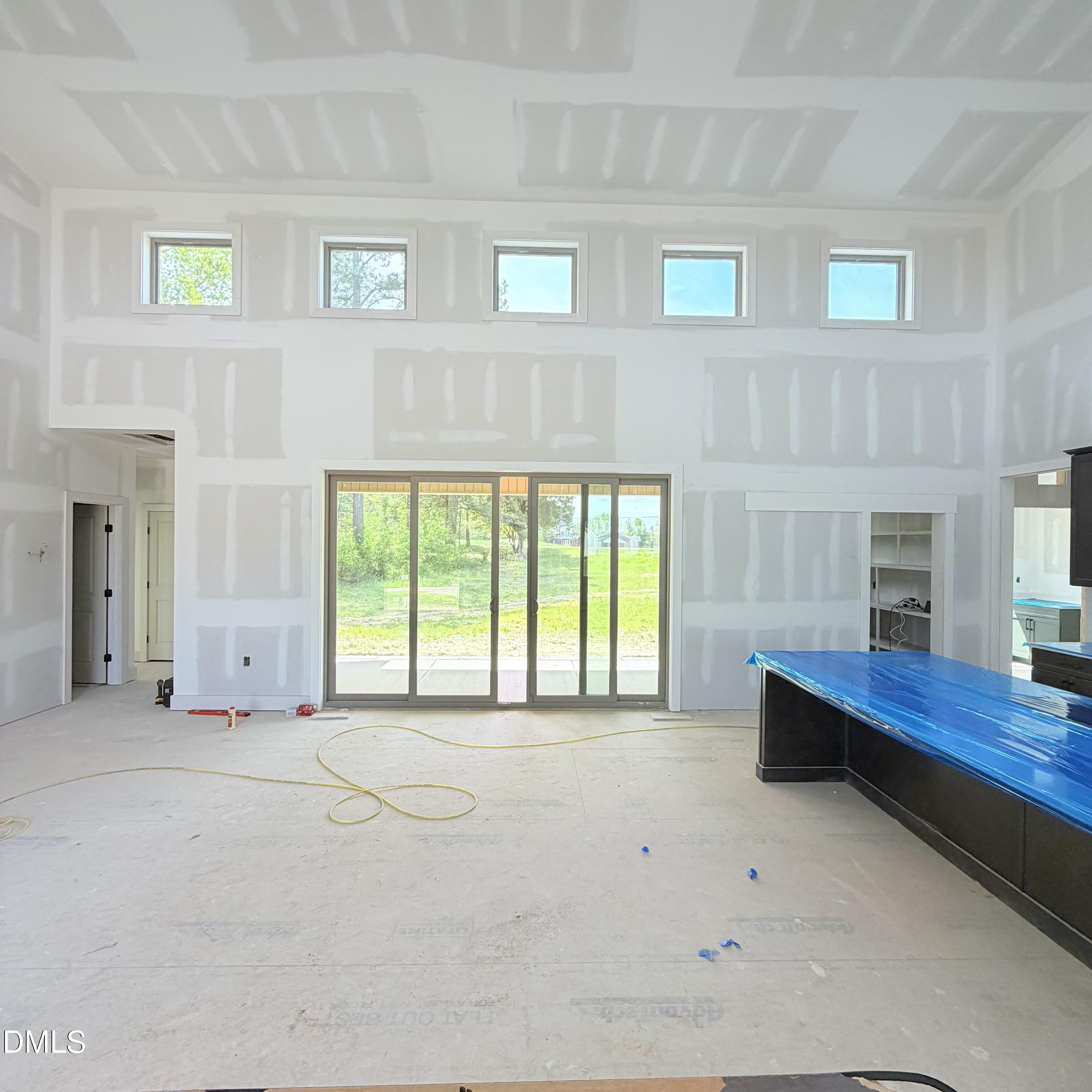 50 Wiggins Road Louisburg, NC 27549 - Photo 4 of 26 Living Room to back patio
