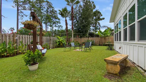 a garden with plants and wooden fence