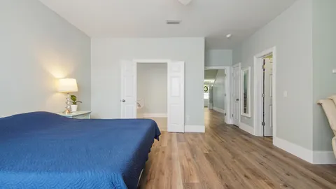 a view of empty room and wooden floor