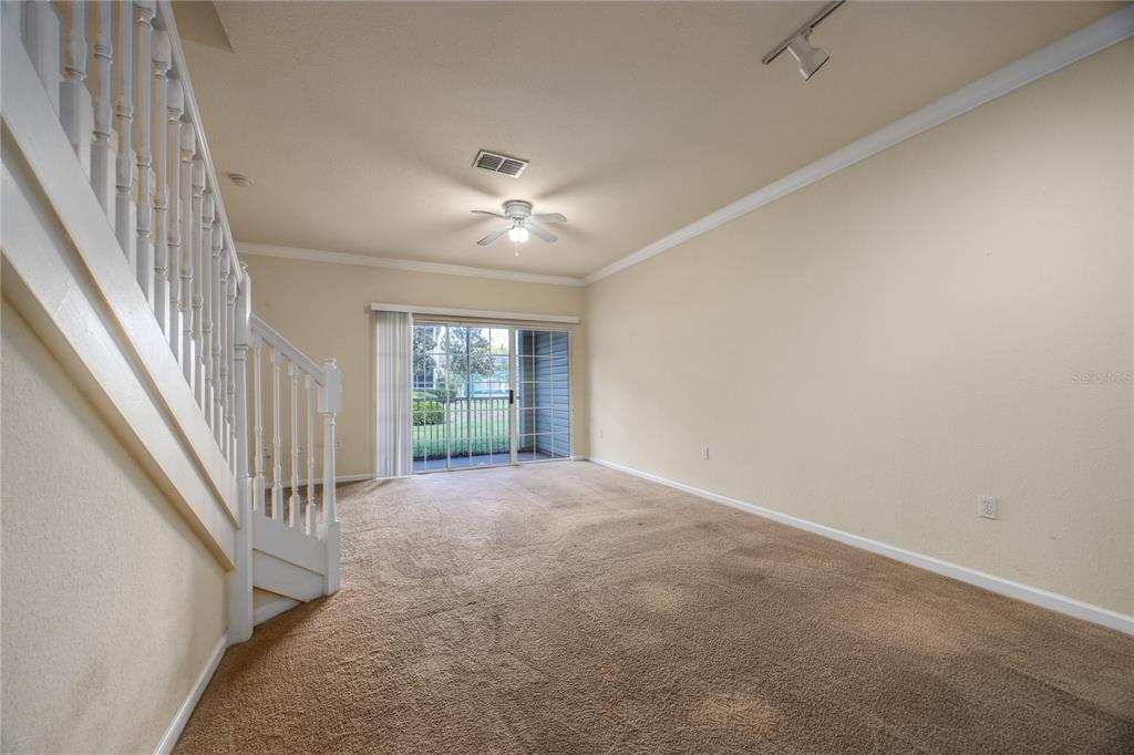 4872 Northwest 42nd Road, Unit 105 Gainesville, FL 32606 - Photo 11 of 38 a view of an empty room with a window
