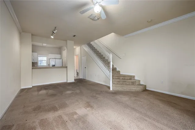 a view of a hallway with staircase
