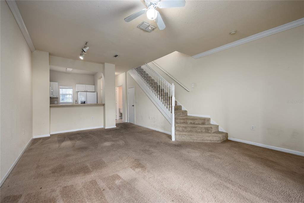 4872 Northwest 42nd Road, Unit 105 Gainesville, FL 32606 - Photo 13 of 38 a view of a hallway with staircase