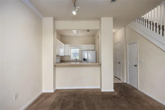 a view of a kitchen from the hallway