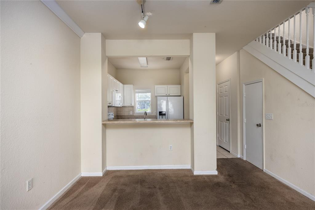 4872 Northwest 42nd Road, Unit 105 Gainesville, FL 32606 - Photo 14 of 38 a view of a kitchen from the hallway